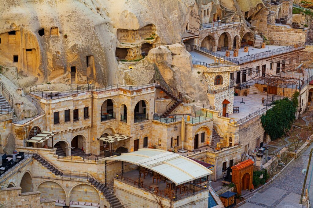 Traditional stone cave hotels and hillside architecture in Cappadocia, Turkey