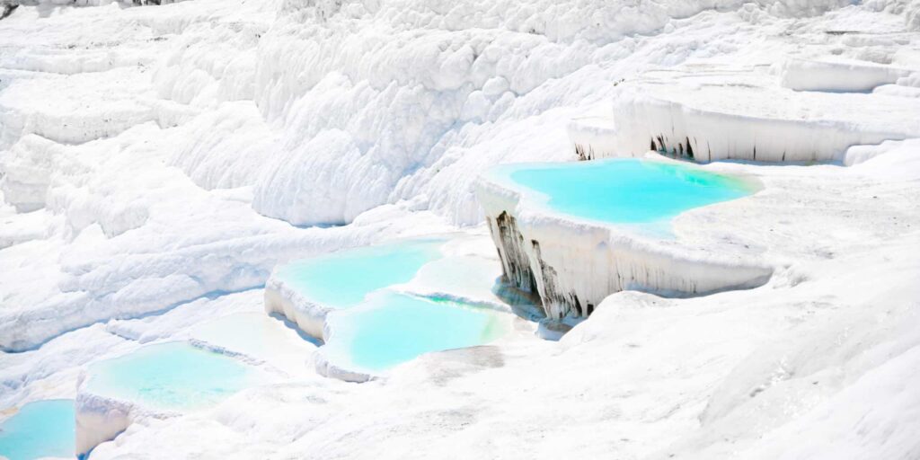 Natural thermal pools and mineral terraces in western Turkey known for their unique landscapes and relaxing atmosphere