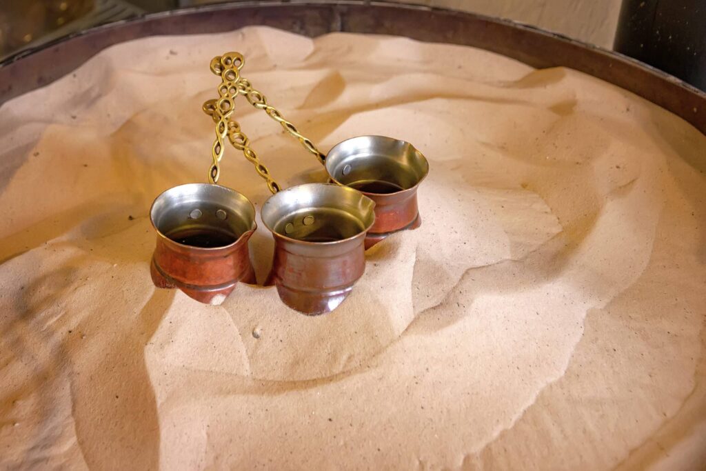 Traditional Turkish coffee brewed over hot sand in Cappadocia, Turkey